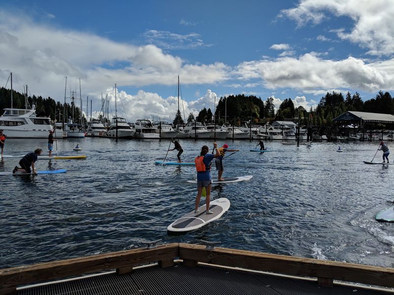 Kayaking And Paddleboarding On Calm, Glittering Waters Kayaking And Paddleboarding On Calm, Glittering Waters