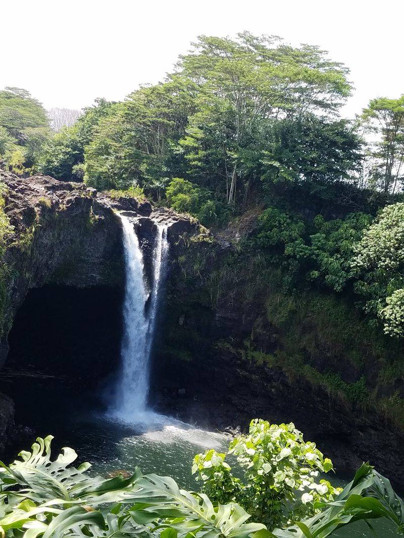 Rainbow Falls And Its Colorful Mist