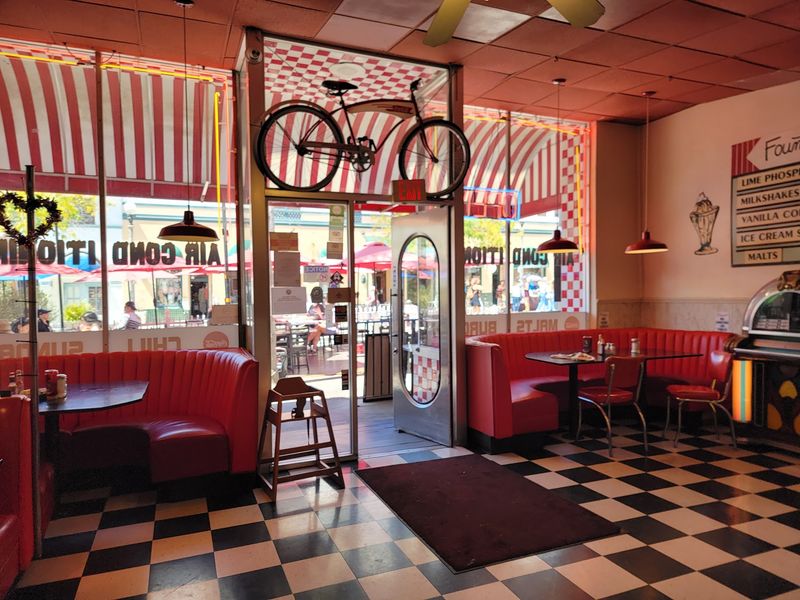 Red Booths, Checkered Floors, And Neon Everywhere