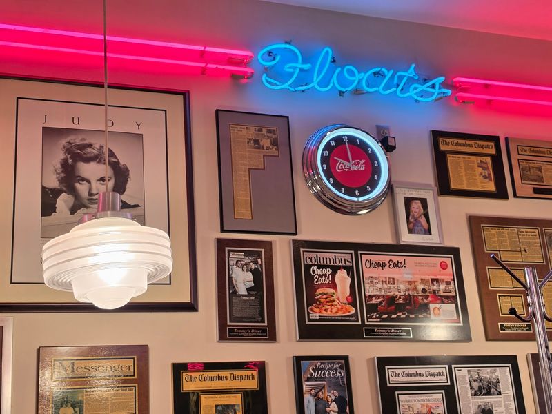 Red Vinyl Booths And Neon Glow