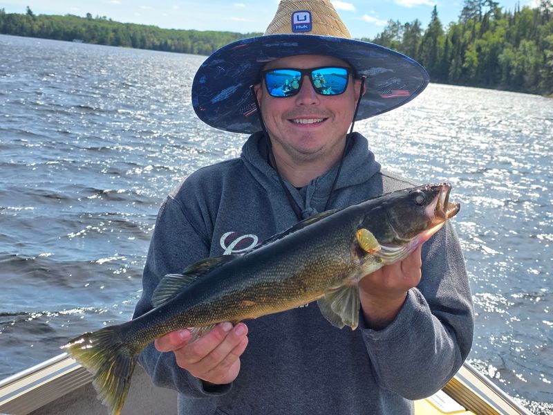 Reeling In Walleye Across The Water Reeling In Walleye Across The Water