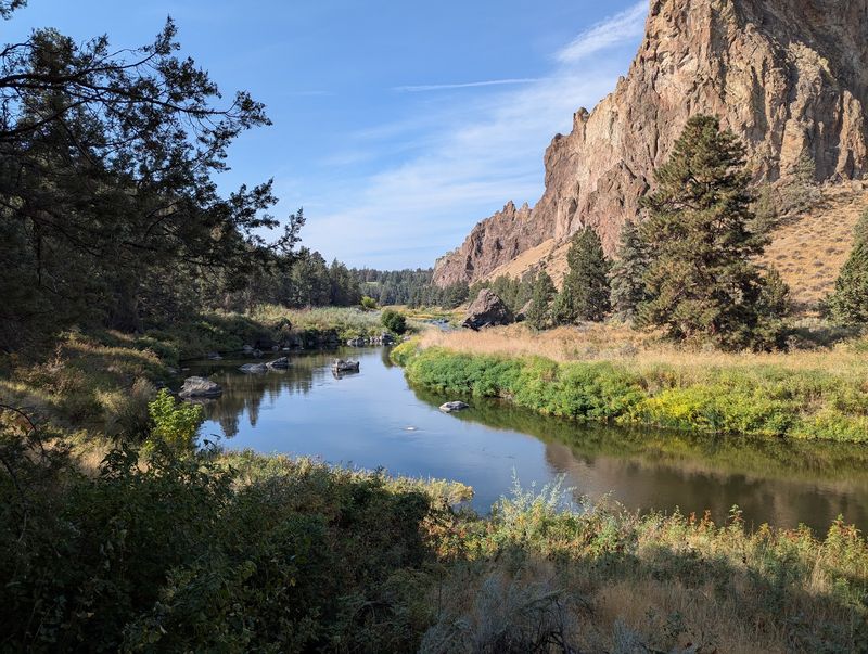 The Peaceful River Path Below the Cliffs