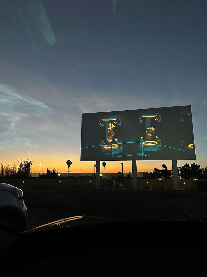 Two Screens Lighting Up The Night