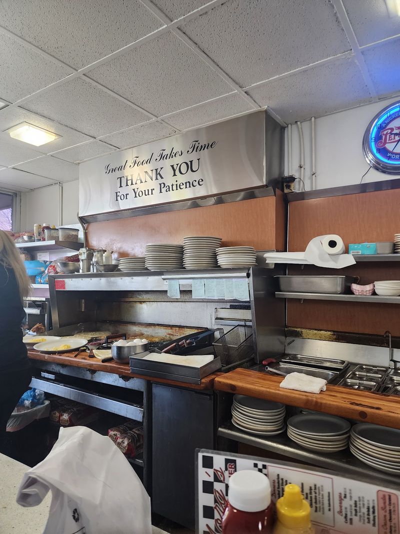 Watch the Cooks Work the Grill