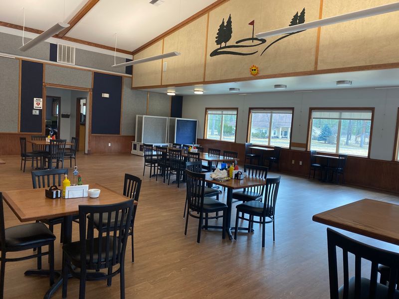 A Bar and Grill With a Country Club Backdrop A Bar and Grill With a Country Club Backdrop