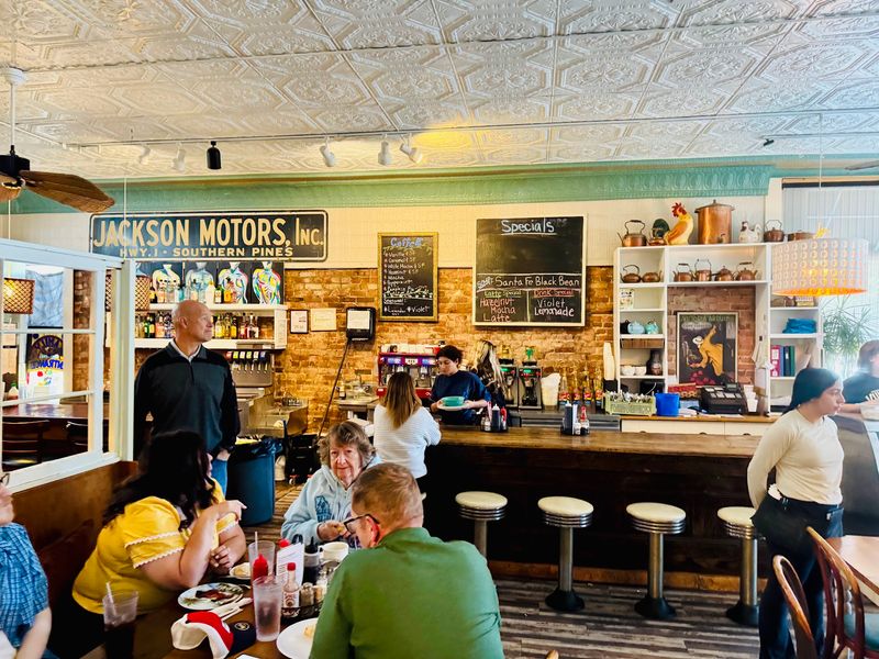 A Brick-Walled Cafe In The Heart Of Town