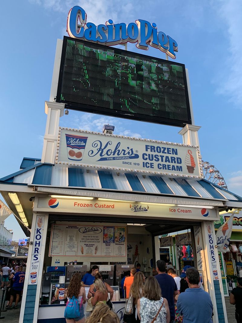 A Small Stand In A Big Boardwalk Crowd A Small Stand In A Big Boardwalk Crowd