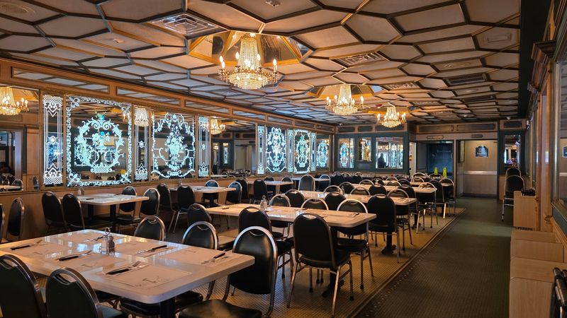 Chandeliers, Mirrors, And A Roomy Dining Hall