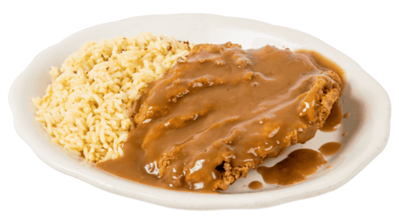 Chicken And Waffles Under A Blanket Of Gravy