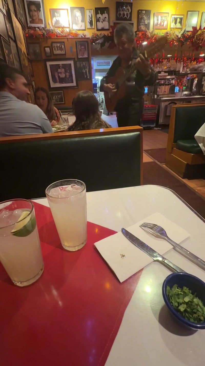 Mariachis Wandering Between The Tables