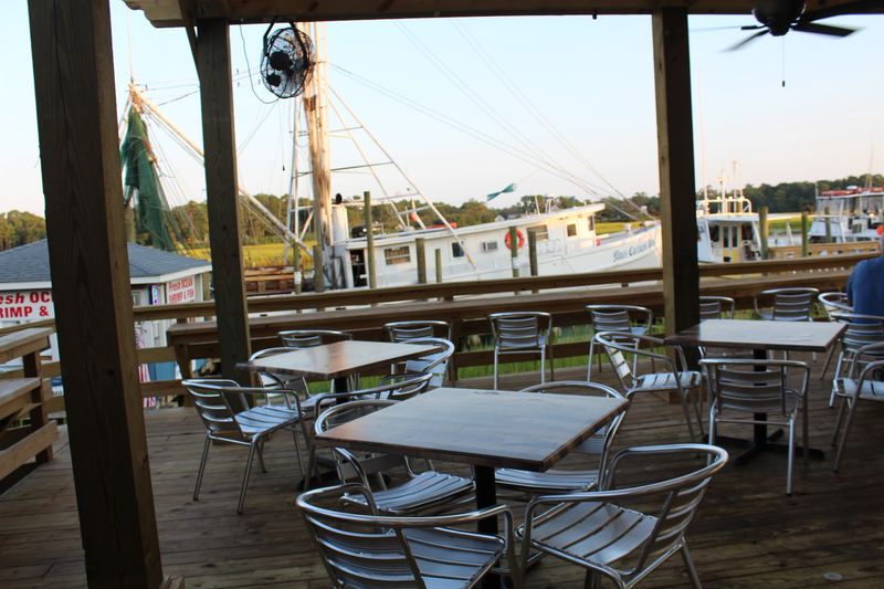 Patio Seats and Passing Boats