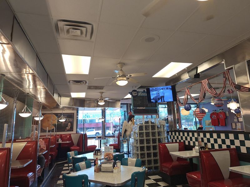 Red Booths and a Nod to the King