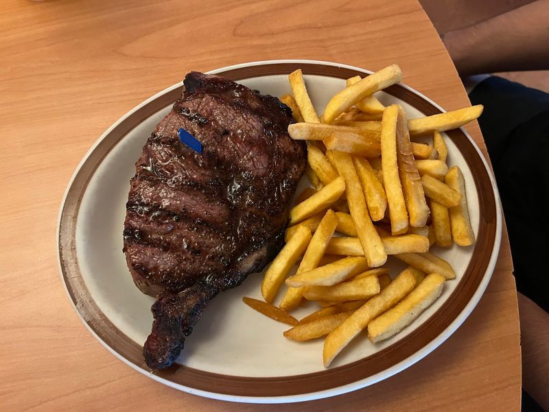 The Bone-In Ribeye That Anchors the Menu