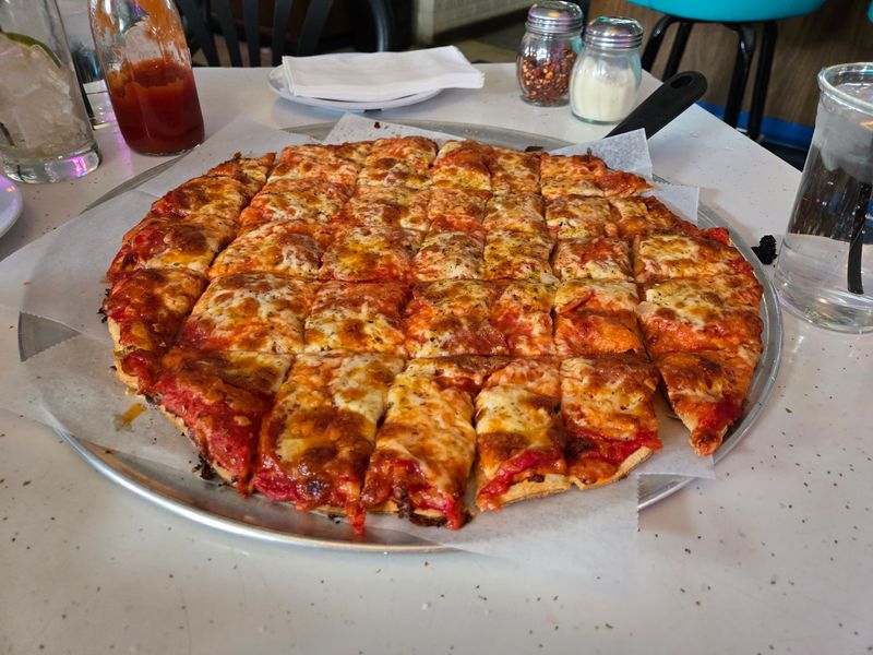 The Cracker-Thin Crust Behind the Fame The Cracker-Thin Crust Behind the Fame