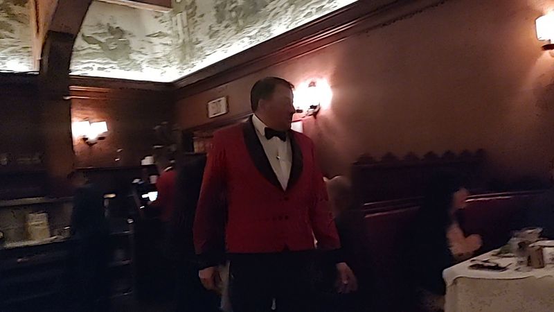 Waiters in Red Coats and Old-School Service