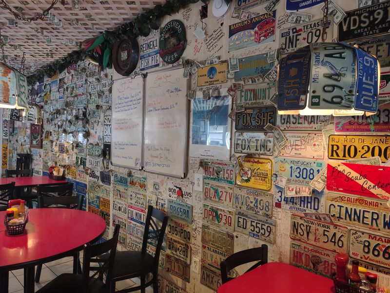 Walls Covered in License Plates and Dollar Bills Walls Covered in License Plates and Dollar Bills