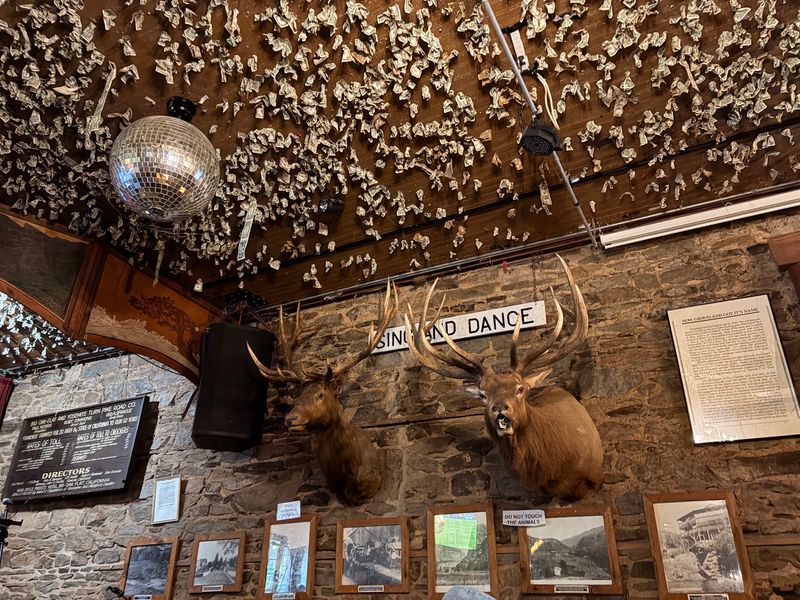 A Ceiling Covered in Dollar Bills