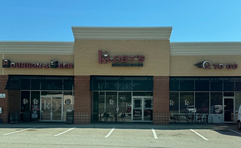 A Strip Mall Address With Smoke Behind It