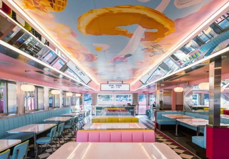 Bright Booths And A Cartoon Ceiling