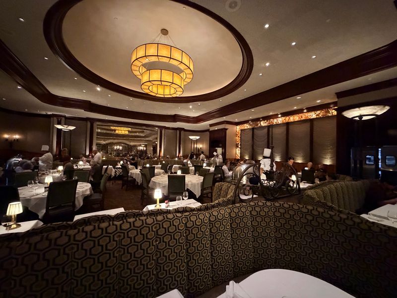 Dark Wood, Curved Booths, and White Linen