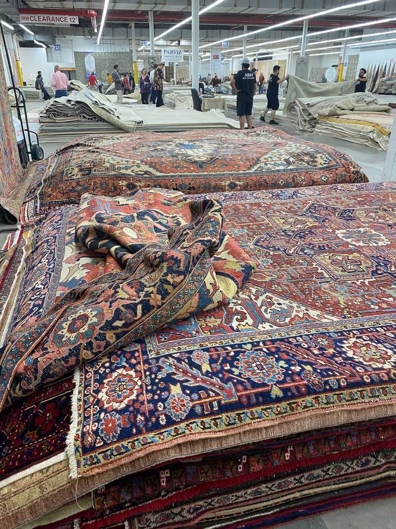 Rugs Stacked Almost to the Ceiling