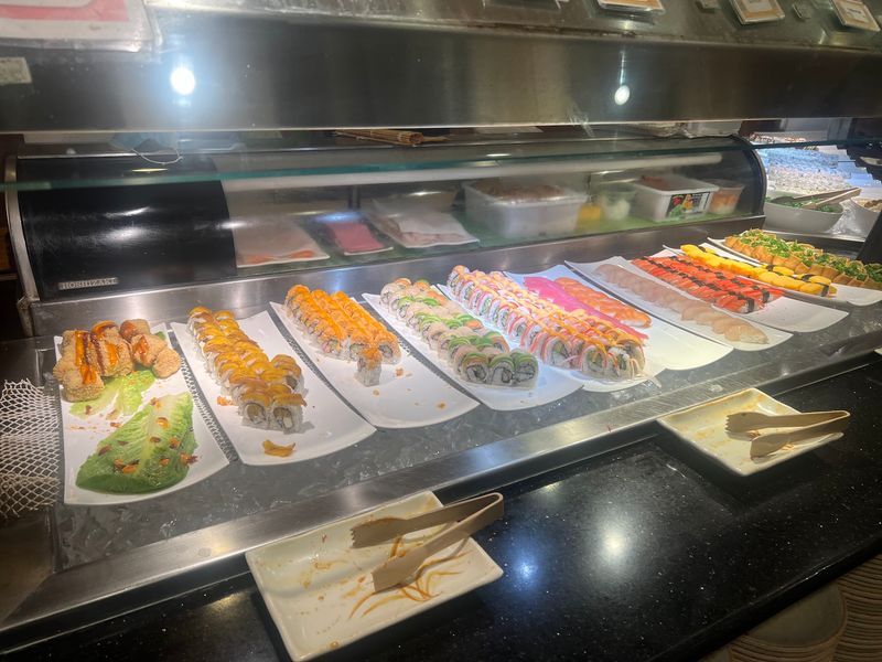Sushi Rolls and a Grill With a Chef
