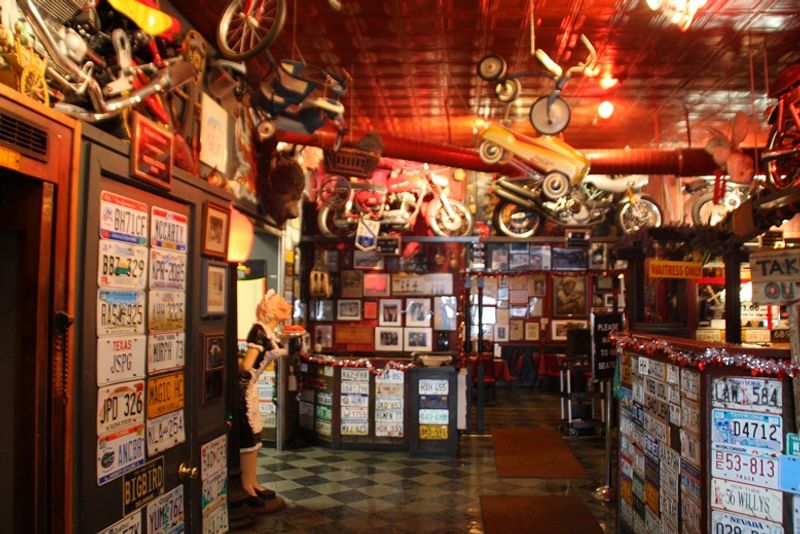 Walls Packed With Memorabilia and Motorcycles