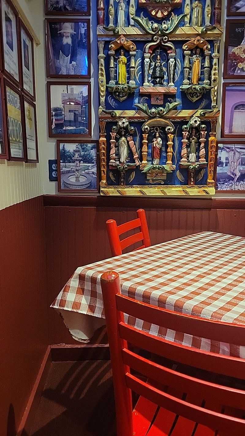 Walls of Photos, Mementos and Checkered Cloths Walls of Photos, Mementos and Checkered Cloths